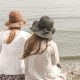 beach, hats, women, pair, couple, fashion, style, stylish, backs, nature, young women, shore, seashore, friendship, girl friends, ocean, outdoors, people, sand, sea, water, friends